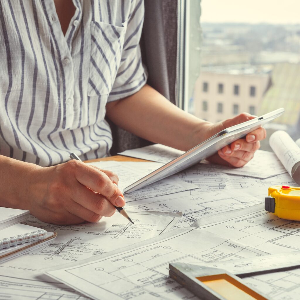 Architect works remotely from home in quarantine, lockdown covid 19 coronavirus. Remote work, stay